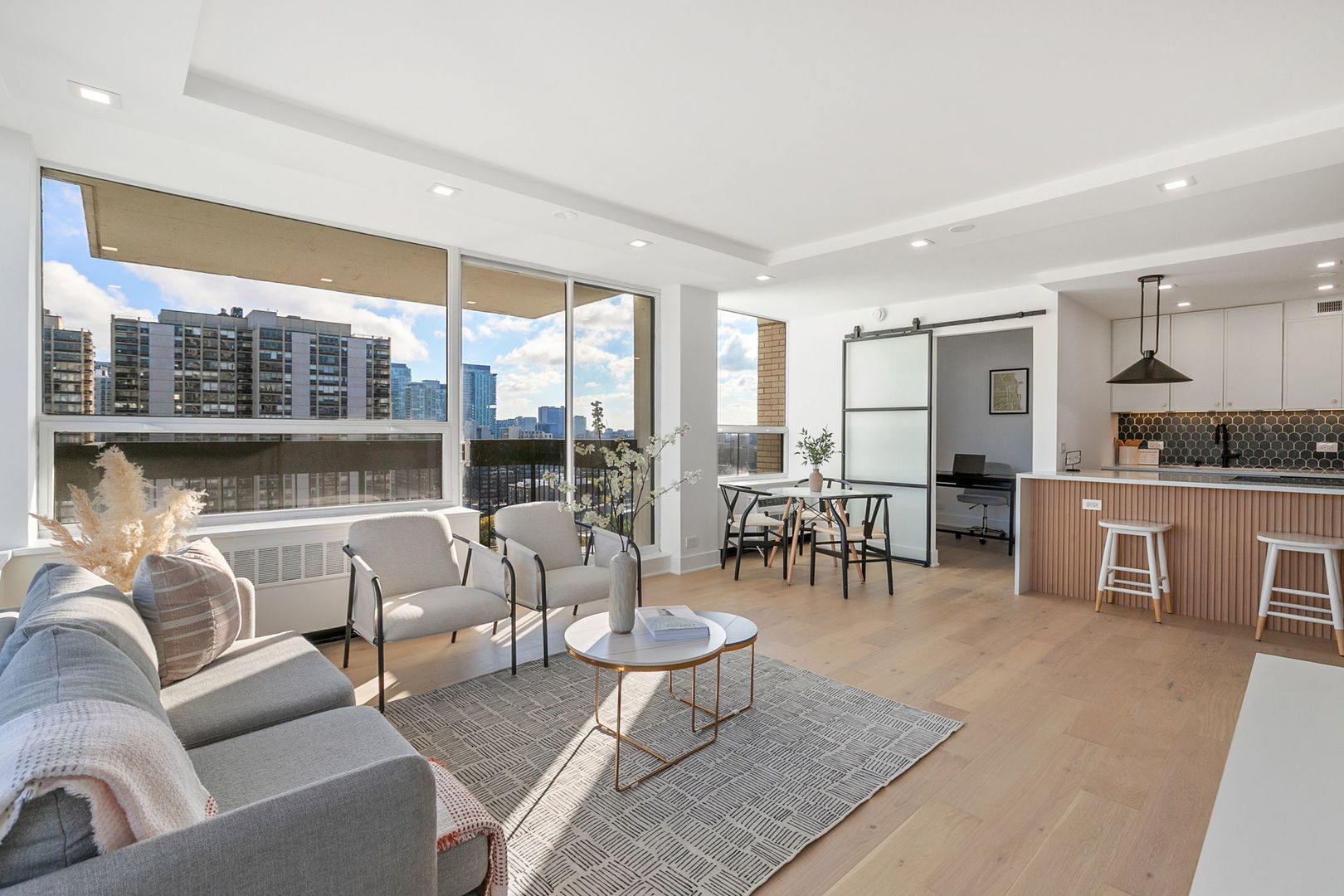 1460 North Sandburg Terrace, Unit 2001A Chicago, IL 60610 - Photo 4 of 39 a living room with furniture and a large window