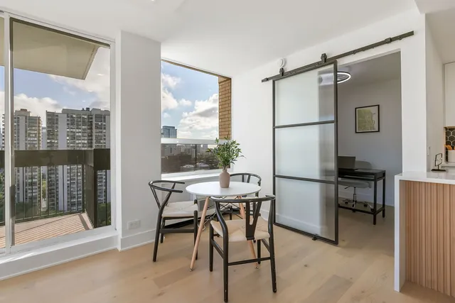 a view of a dining room with furniture window and outside view