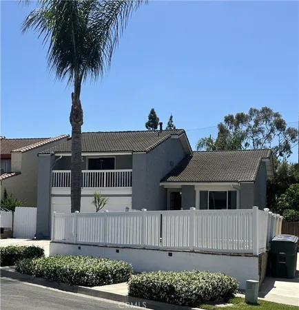 front view of a house with a fence