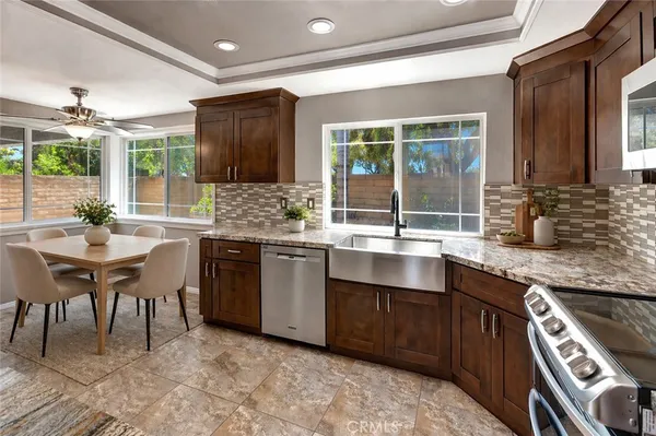 a kitchen with a sink stove and cabinets