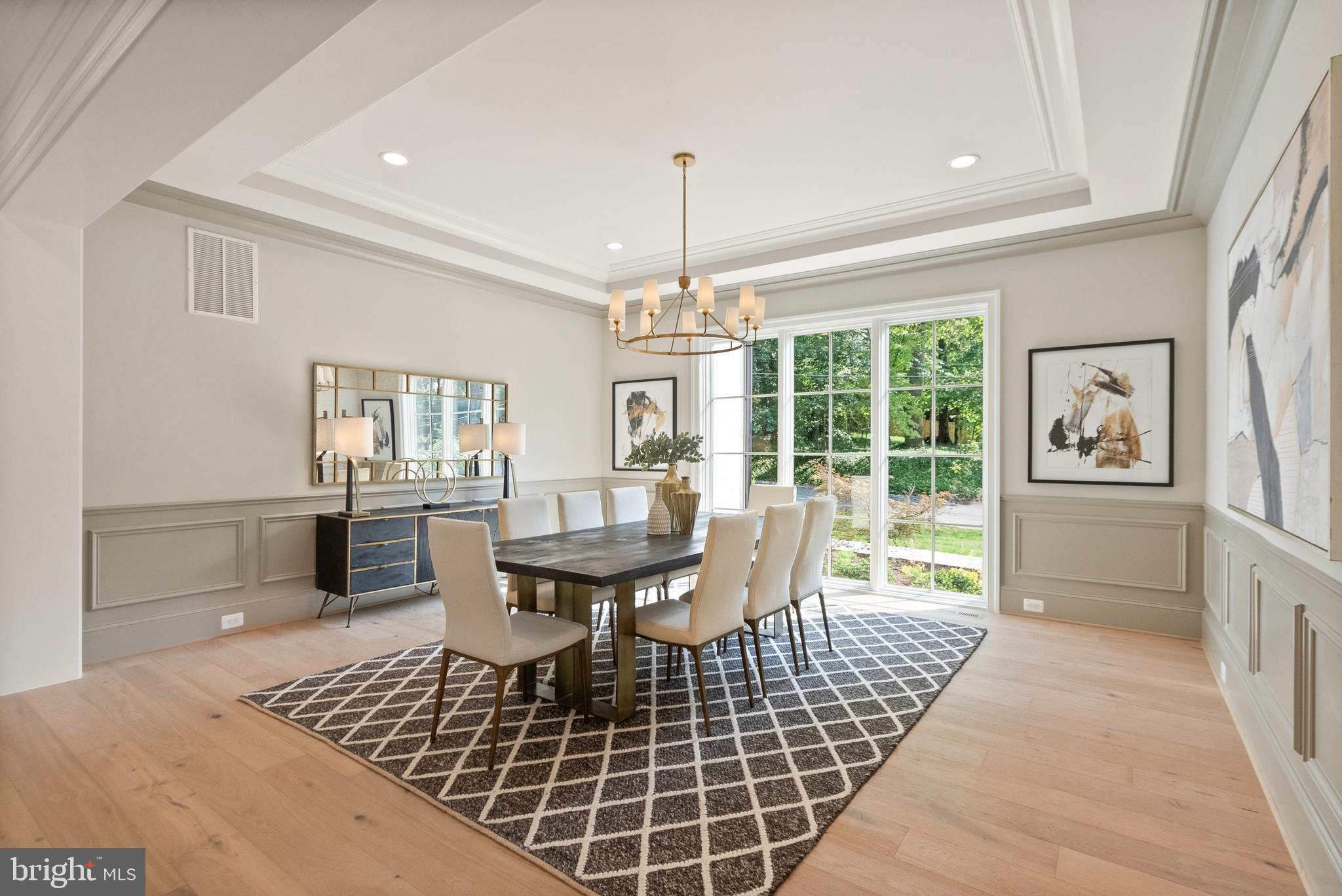 1104 Sharon Court McLean, VA 22101 - Photo 12 of 27 a dining room with furniture a chandelier and wooden floor