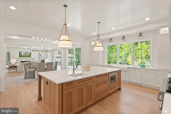 a large kitchen with a table and chairs in it