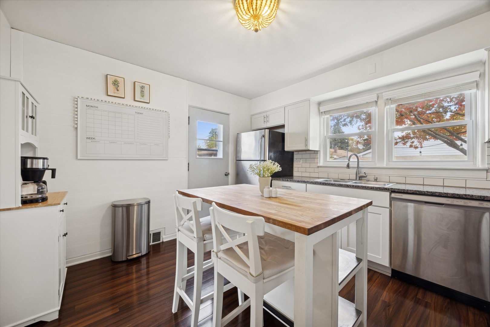 601 Homestead Road La Grange Park, IL 60526 - Photo 12 of 29 a kitchen with a table chairs sink and cabinets