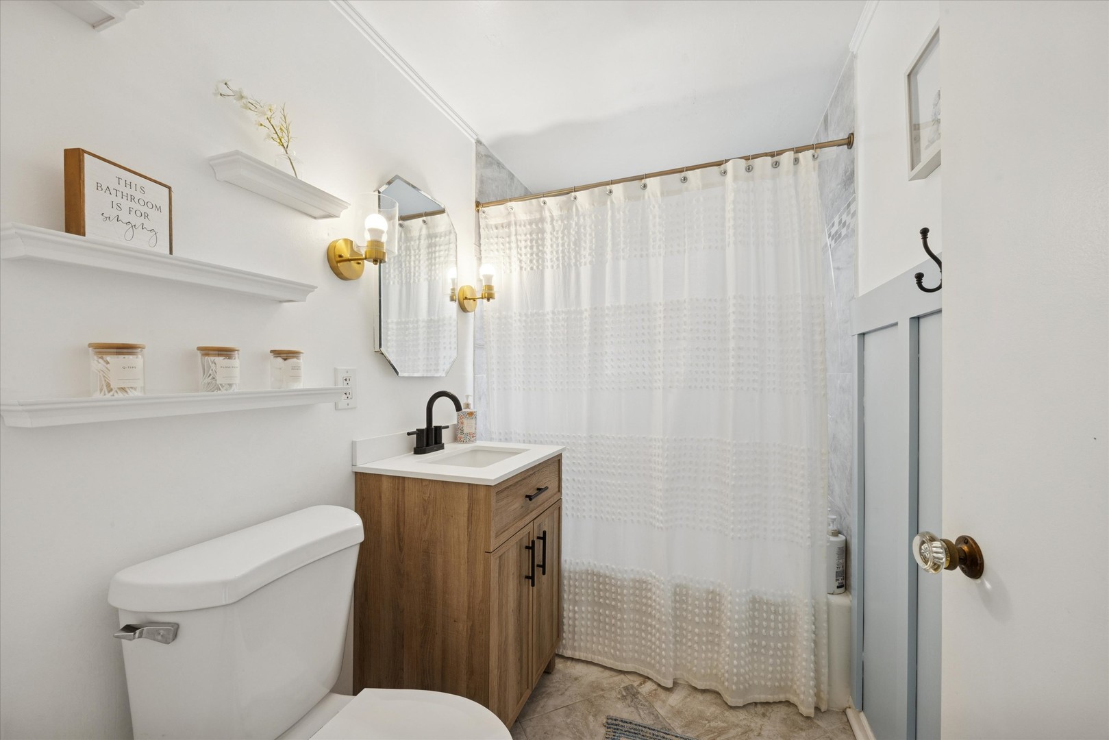 601 Homestead Road La Grange Park, IL 60526 - Photo 19 of 29 a bathroom with a sink a toilet and shower curtain