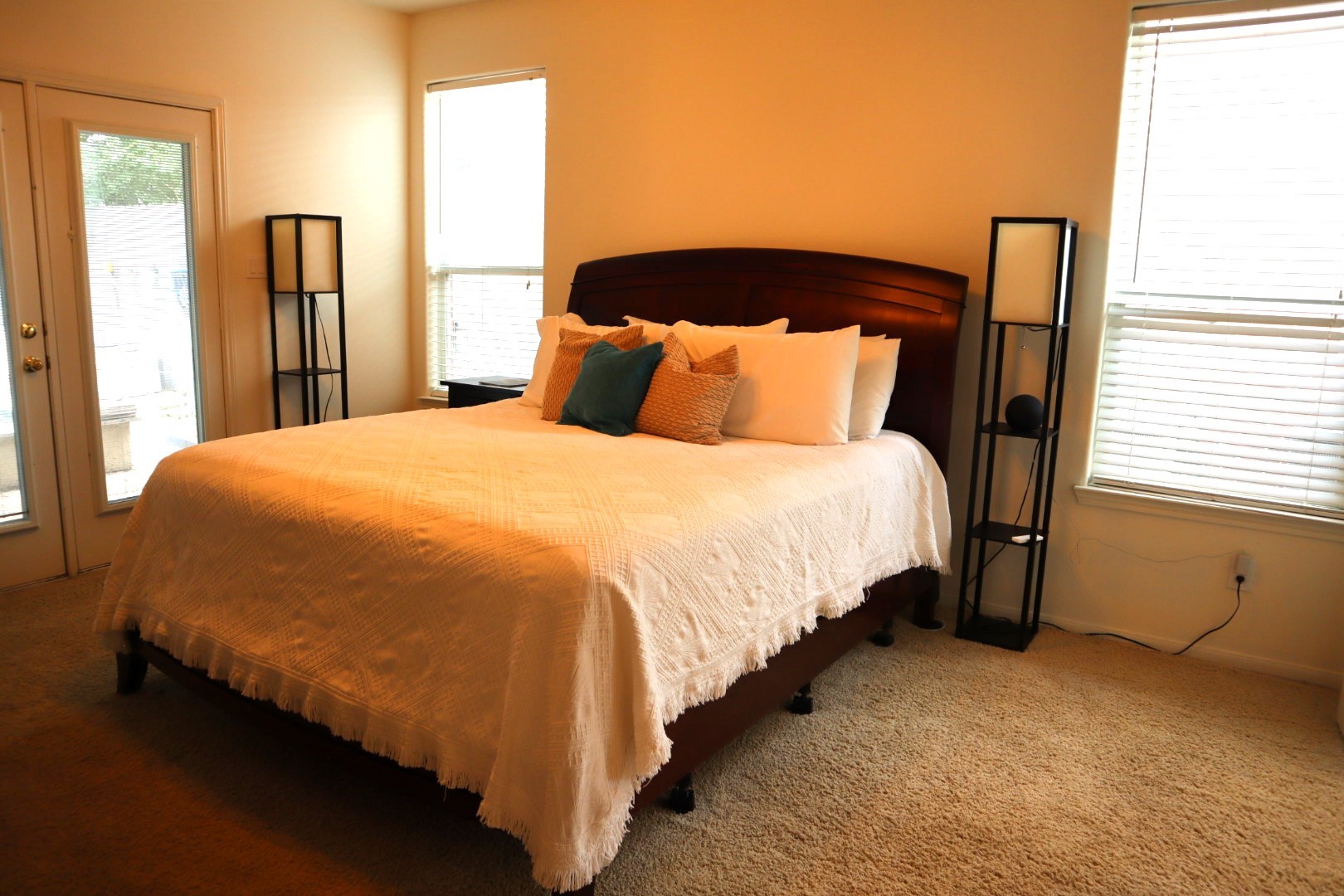 19114 Emory Trail Spring, TX 77388 - Photo 14 of 32 This inviting Owner's Suite features a relaxing atmosphere that is well-lit with natural light from two windows and glass doors. The neutral carpet and light wall color create a warm, welcoming atmosphere.