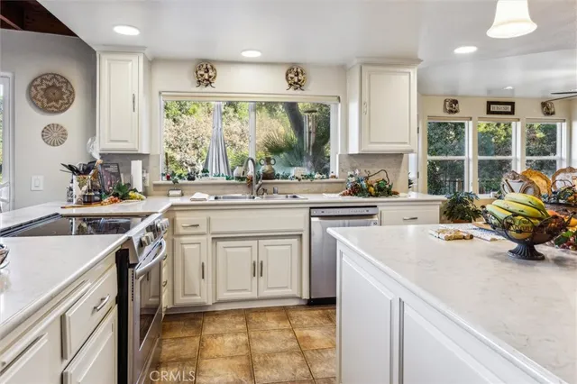 a kitchen with a sink stove and cabinets
