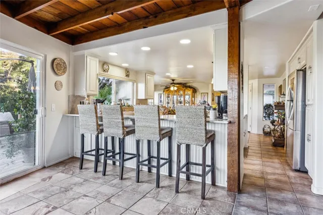 a dining room with furniture and a chandelier
