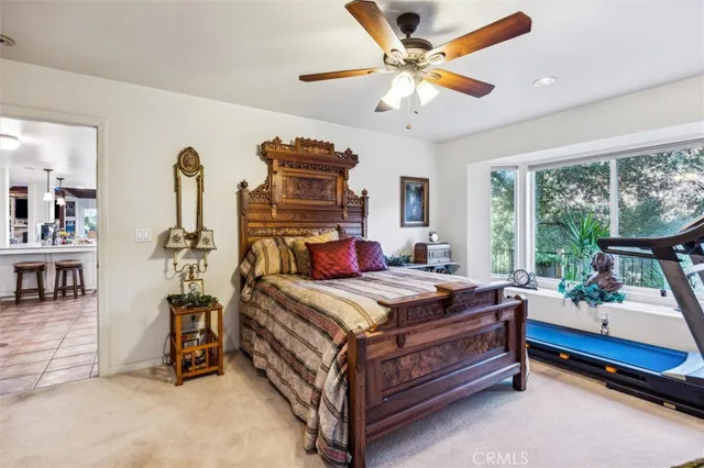 a spacious bathroom with a toilet sink and mirror