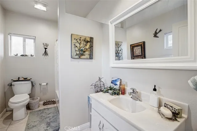 a view of a patio with table and chairs