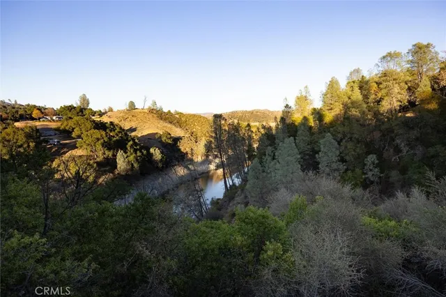an aerial view of residential house with outdoor space and river