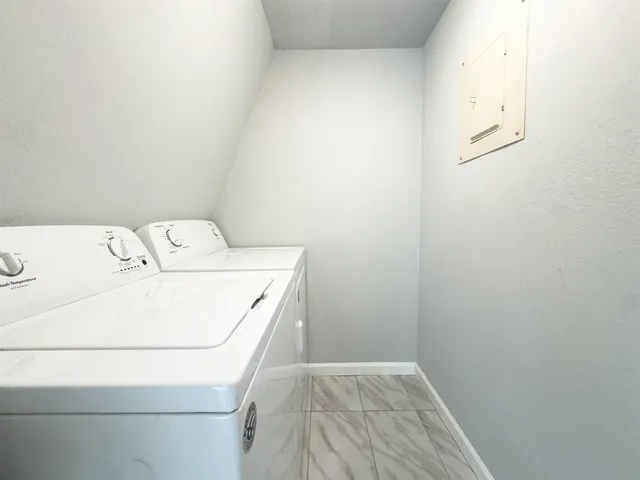 a utility room with dryer and washer