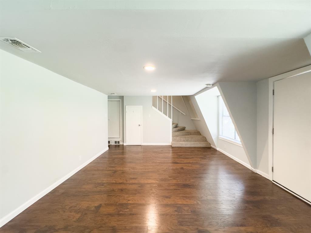 1308 Cordell Street, Unit 1 Denton, TX 76201 - Photo 5 of 10 a view of an empty room with wooden floor