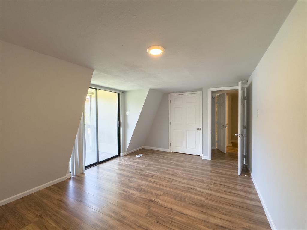 1308 Cordell Street, Unit 1 Denton, TX 76201 - Photo 10 of 10 a view of an empty room with wooden floor and closet