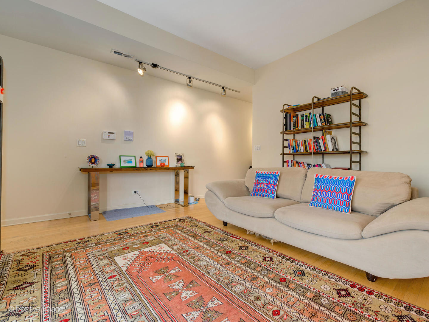 1829 North Mohawk Street, Unit 2N Chicago, IL 60614 - Photo 11 of 16 a living room with furniture and a rug