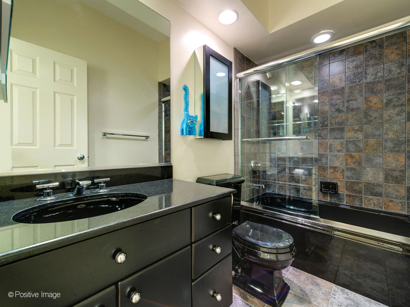 1829 North Mohawk Street, Unit 2N Chicago, IL 60614 - Photo 13 of 16 a bathroom with a sink a toilet and shower