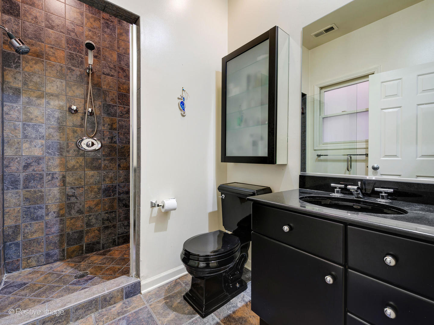 1829 North Mohawk Street, Unit 2N Chicago, IL 60614 - Photo 15 of 16 a bathroom with a sink a toilet and shower