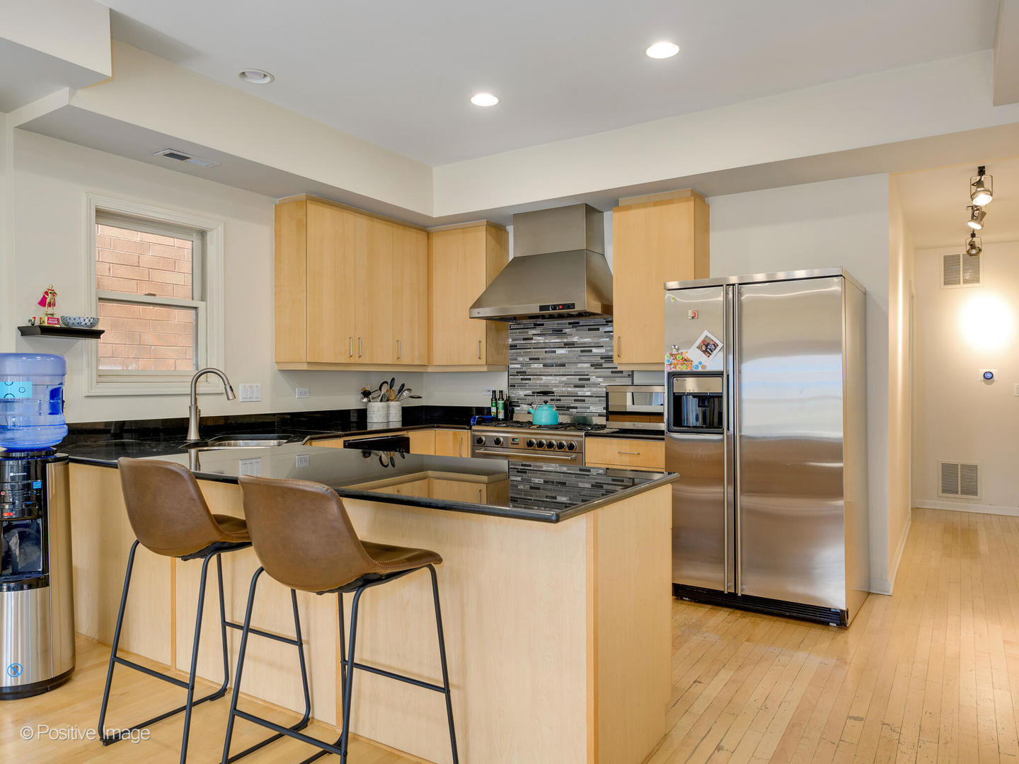 1829 North Mohawk Street, Unit 2N Chicago, IL 60614 - Photo 7 of 16 a kitchen with stainless steel appliances granite countertop a sink and a refrigerator