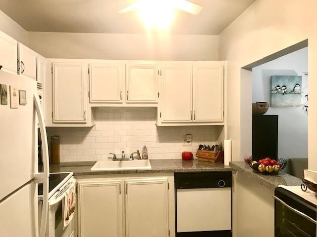 257 South Cypress Road, Unit 423 Pompano Beach, FL 33060 - Photo 16 of 38 a kitchen with a sink stove and refrigerator