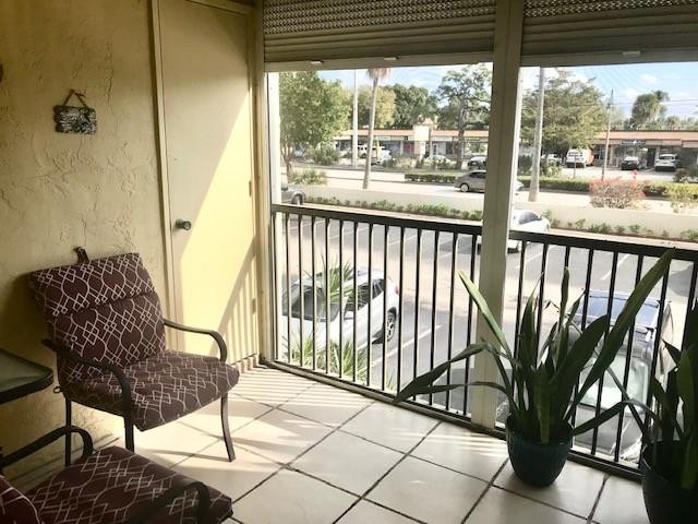 257 South Cypress Road, Unit 423 Pompano Beach, FL 33060 - Photo 22 of 38 a view of a chairs and table in the balcony