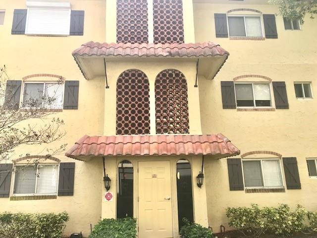 257 South Cypress Road, Unit 423 Pompano Beach, FL 33060 - Photo 24 of 38 a view of a white house