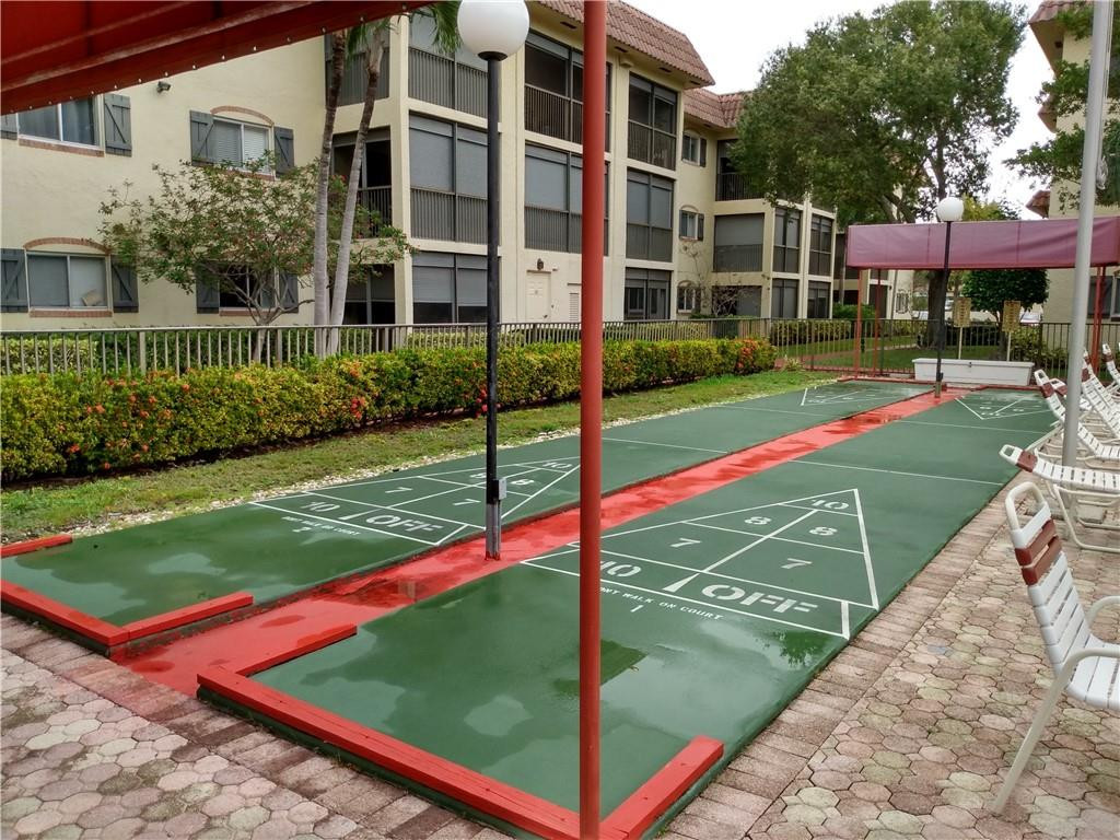 257 South Cypress Road, Unit 423 Pompano Beach, FL 33060 - Photo 30 of 38 a view of a backyard with trampoline