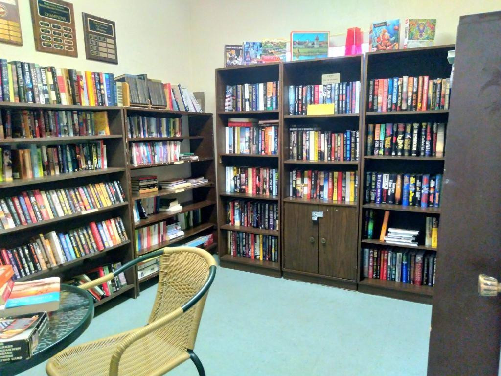 257 South Cypress Road, Unit 423 Pompano Beach, FL 33060 - Photo 31 of 38 a view of a workspace with bookshelf