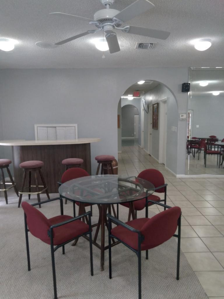 257 South Cypress Road, Unit 423 Pompano Beach, FL 33060 - Photo 33 of 38 a view of a dining room with furniture
