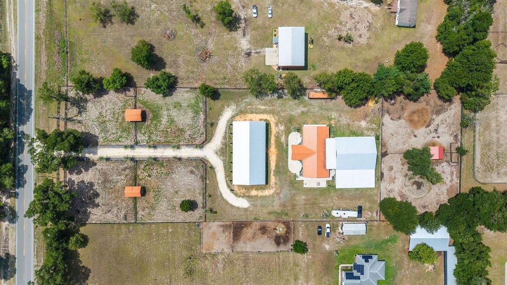 16392 Northeast Jacksonville Road Citra, FL 32113 - Photo 38 of 44 an aerial view of residential houses with outdoor space
