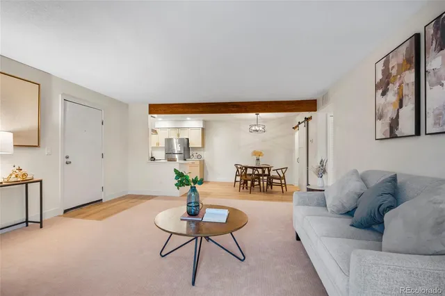 a living room with furniture and a table