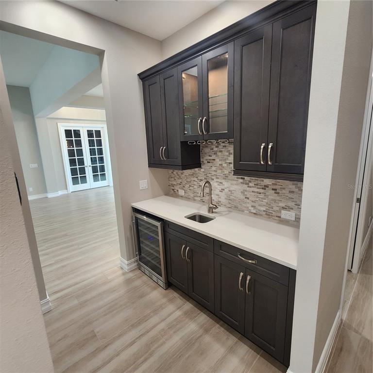 512 Blue Shell Loop Sarasota, FL 34240 - Photo 14 of 44 a bathroom with a sink double vanity granite tub shower and mirror