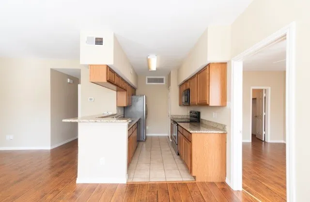 a kitchen with a stove and a refrigerator