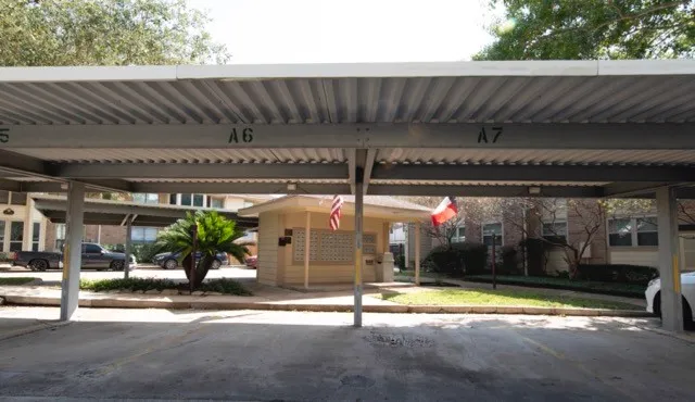 a view of a patio with table and chairs potted plants