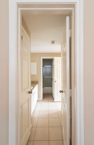 a view of a hallway view with wooden floor and staircase
