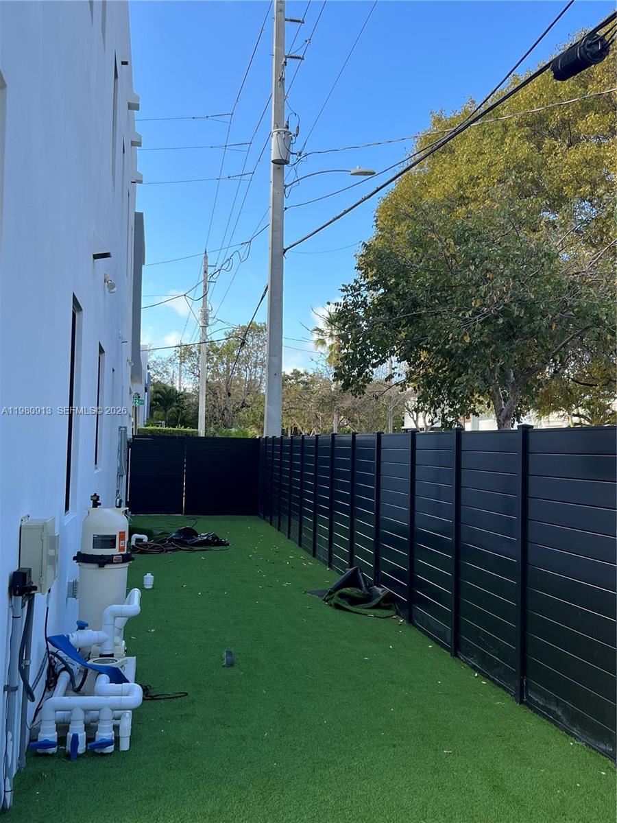 1533 Southwest 22nd Terrace Miami, FL 33145 - Photo 11 of 28 a view of a backyard with wooden fence