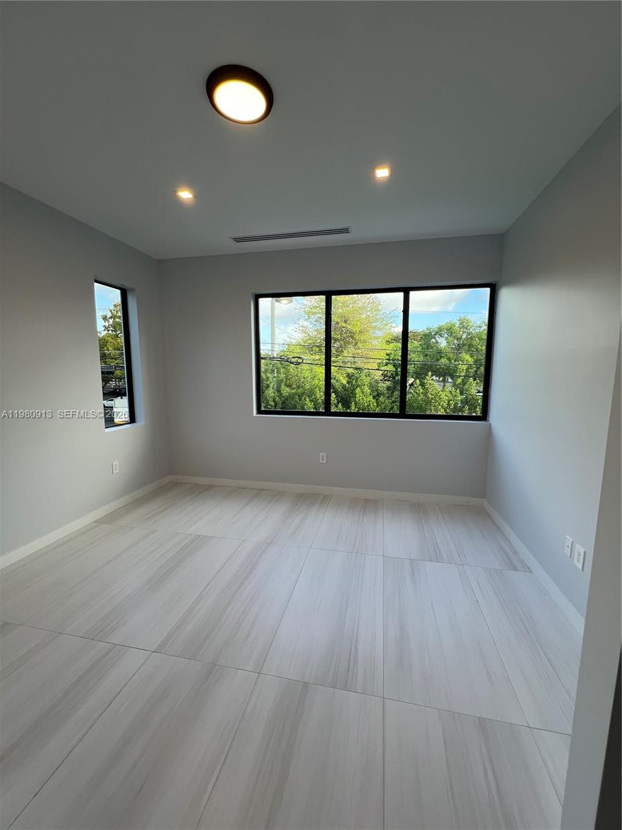 1533 Southwest 22nd Terrace Miami, FL 33145 - Photo 18 of 28 an empty room with windows