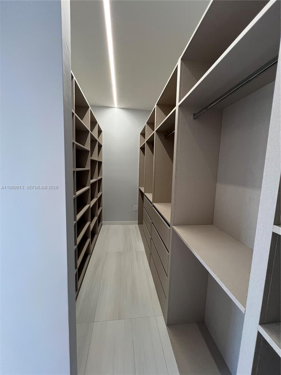 1533 Southwest 22nd Terrace Miami, FL 33145 - Photo 19 of 28 a view of walk in closet with empty racks