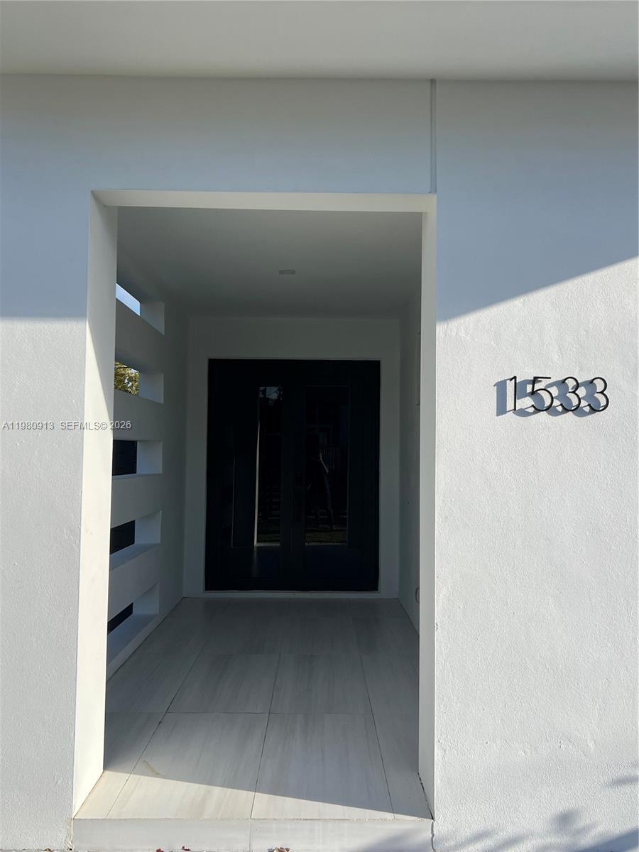 1533 Southwest 22nd Terrace Miami, FL 33145 - Photo 4 of 28 a view of a hallway with wooden floor and a cabinet