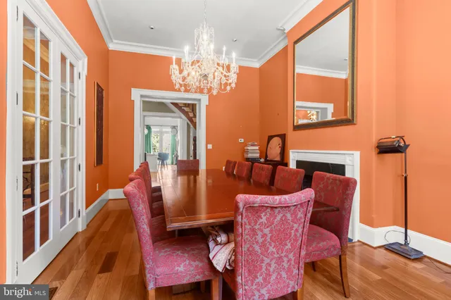 a view of a dining room with furniture and chandelier