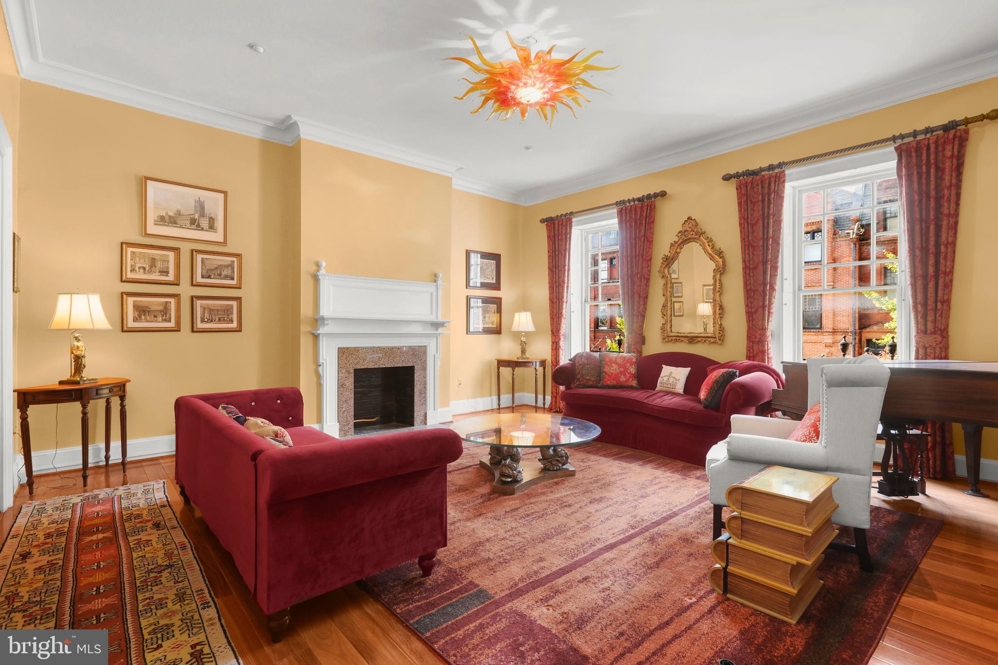 1007 North Calvert Street Baltimore, MD 21202 - Photo 16 of 43 a living room with furniture fireplace and a large window