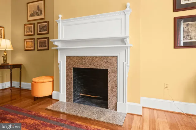 a living room with a couch and a fireplace