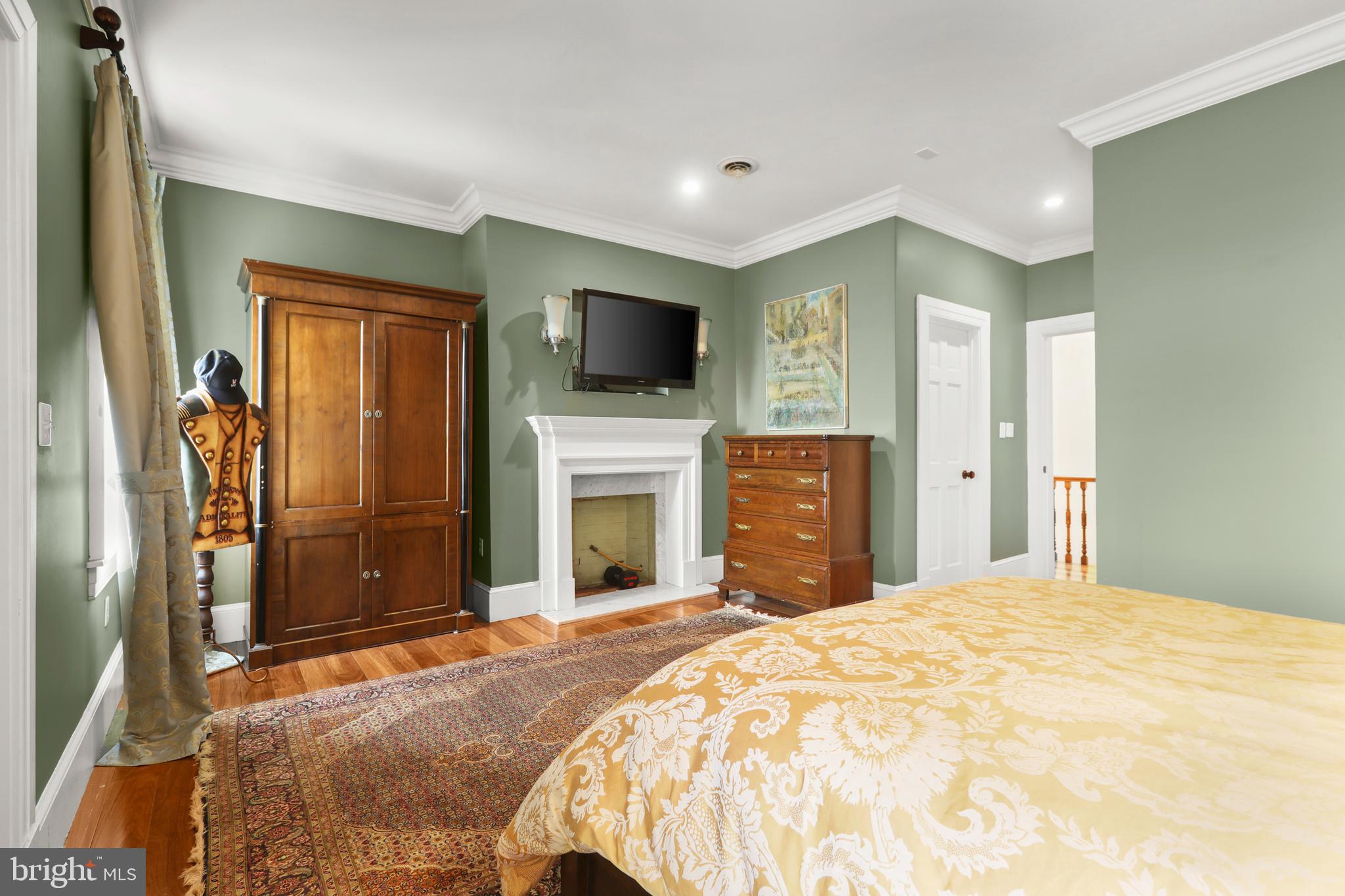 1007 North Calvert Street Baltimore, MD 21202 - Photo 20 of 43 a bedroom with a bed and a flat screen tv