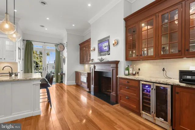 a kitchen with stainless steel appliances granite countertop a stove and cabinets