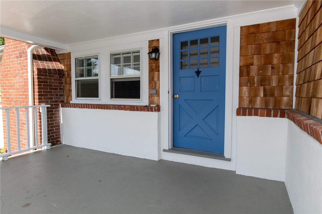 348 West Main Road Portsmouth, RI 02871 - Photo 2 of 26 front entrance from covered porch