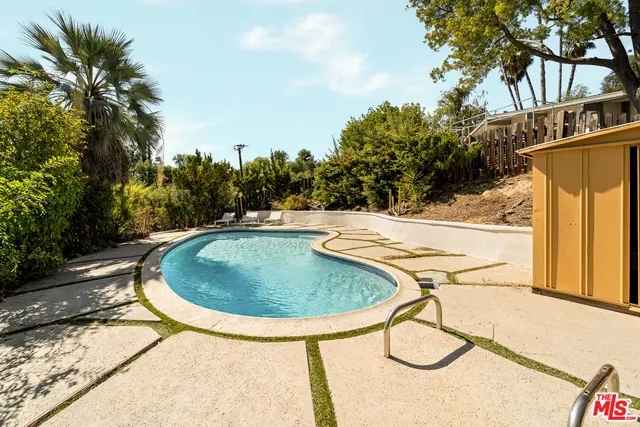 a view of a terrace with a garden and lake view