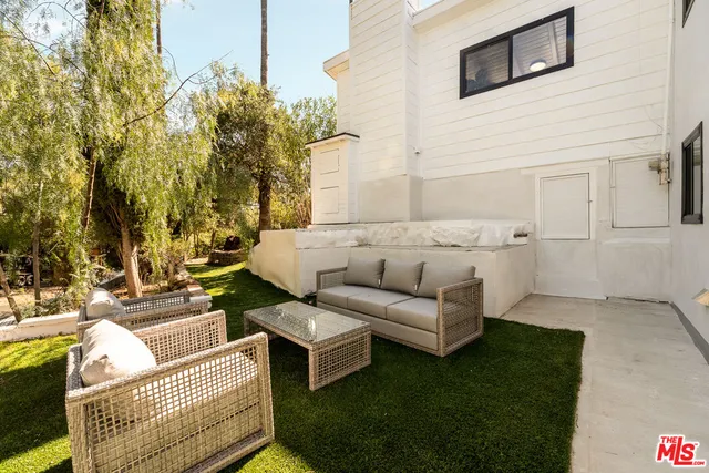 a view of a house with a snow on the road