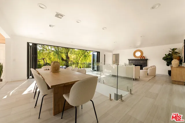 a view of a dining room with furniture wooden floor and a carpet