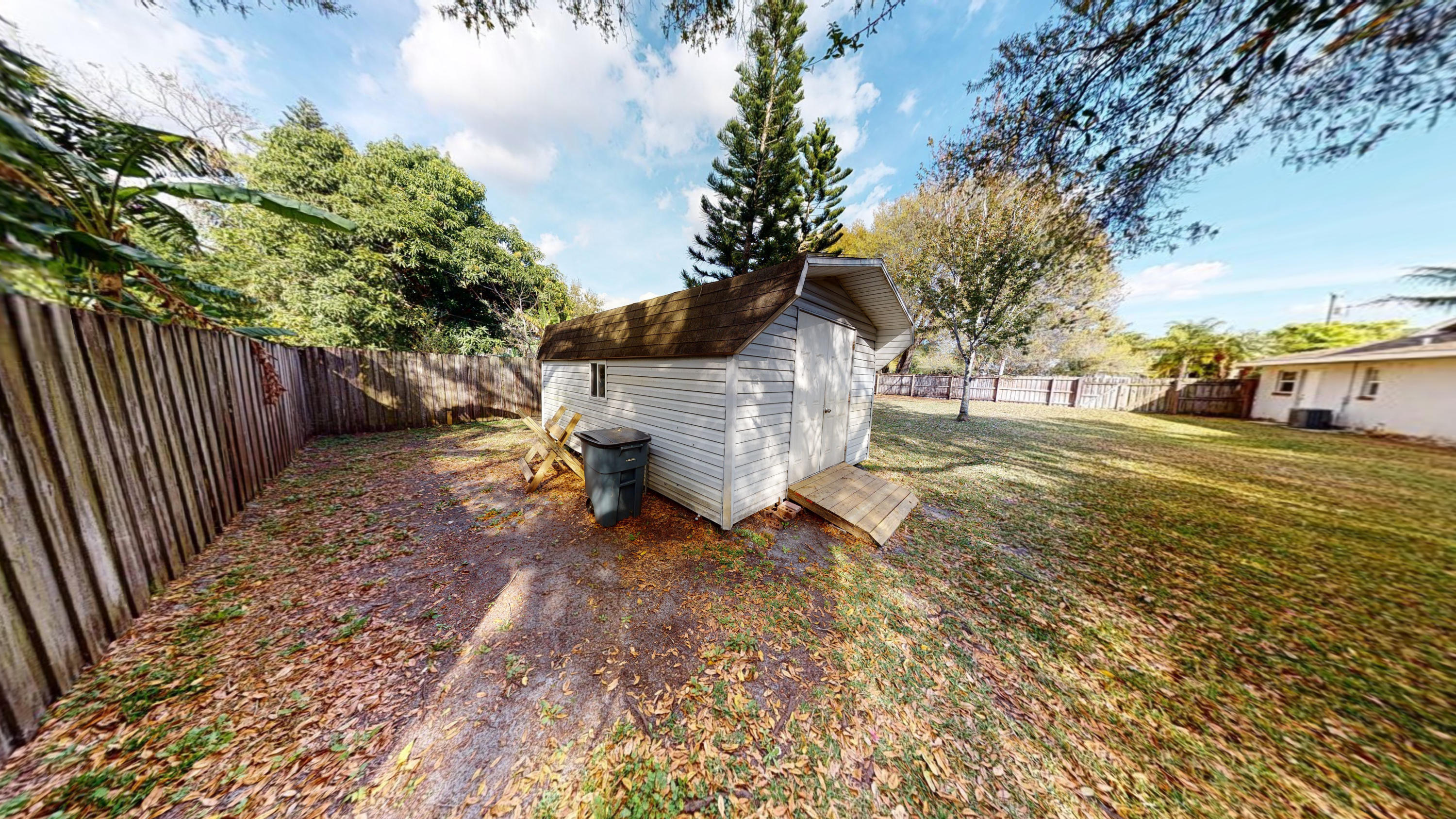 2929 Nicholas Road Fort Pierce, FL 34982 - Photo 18 of 21 Fenced yard with shed