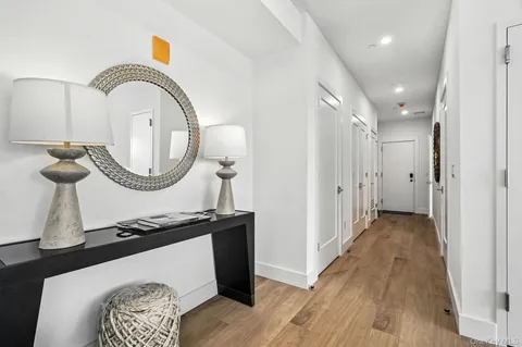 a view of a livingroom with furniture and a mirror