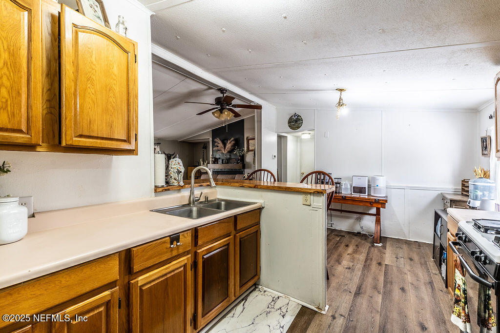 19040 Waterville Road Jacksonville, FL 32226 - Photo 11 of 28 a kitchen with a sink a counter space and appliances
