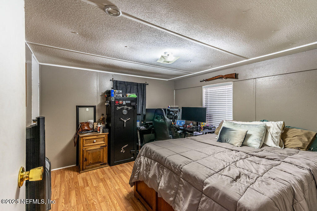 19040 Waterville Road Jacksonville, FL 32226 - Photo 14 of 28 a bedroom with a bed and a closet